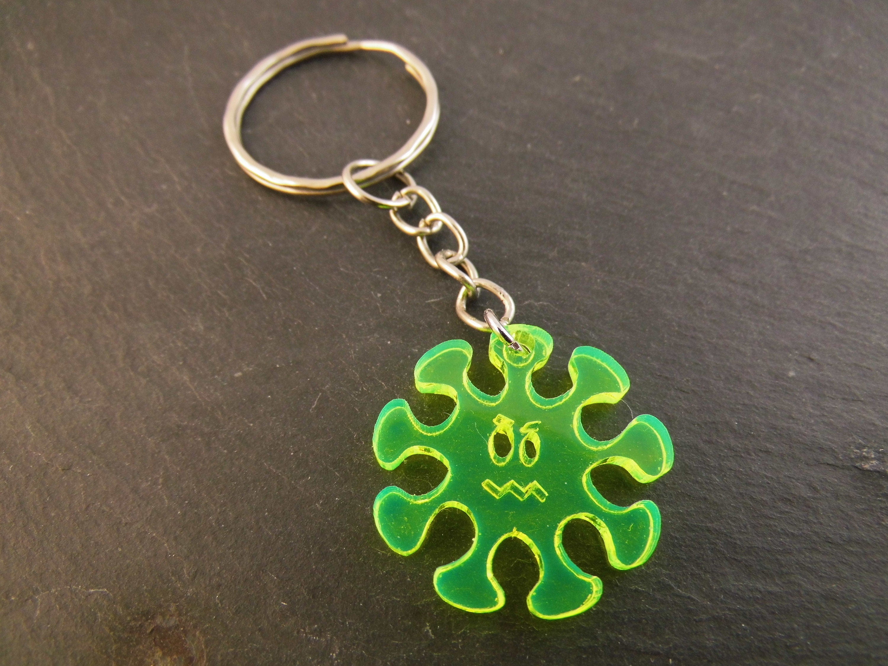 Schlüsselanhänger Virus Männergrippe fluoreszierend Taschenbaumler